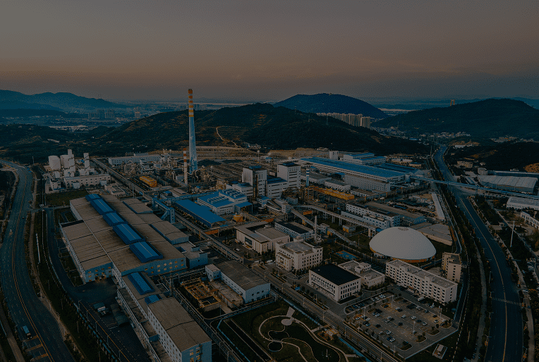 Industrial complex with surrounding hills